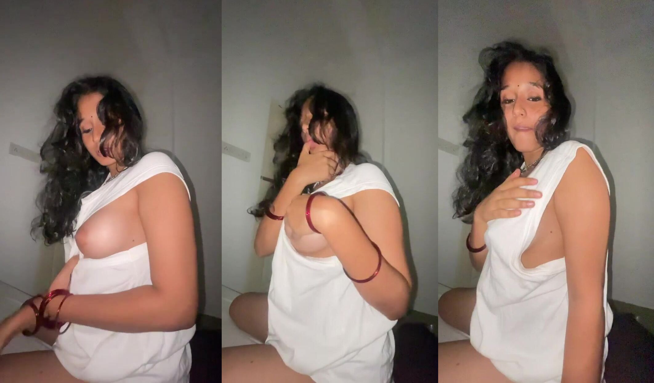 A desi aunty in a saree seductively touching herself